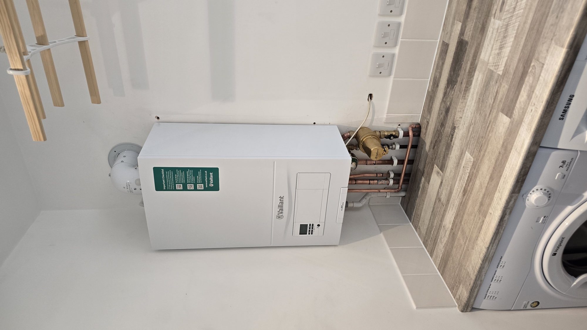 Vaillant boiler installation in a utility room with pressure reducing valve and copper pipework