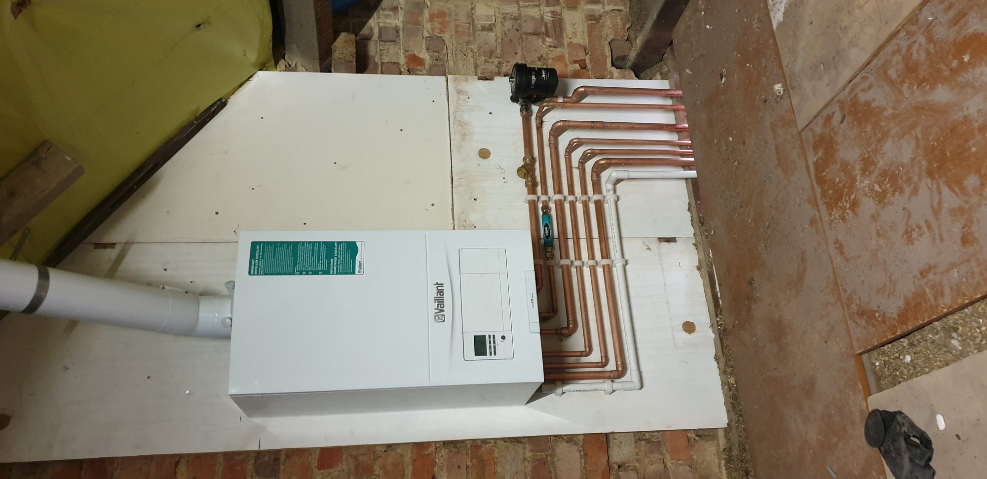 Vaillant boiler installation with neatly bent copper pipework runs and magnetic filter
