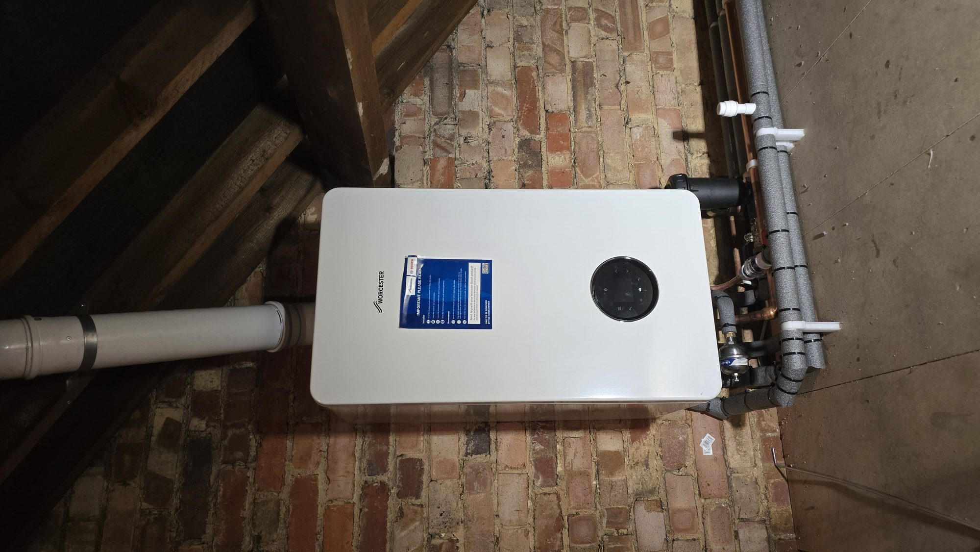 Worcester Bosch combi boiler installation in a loft with lagged heating pipework