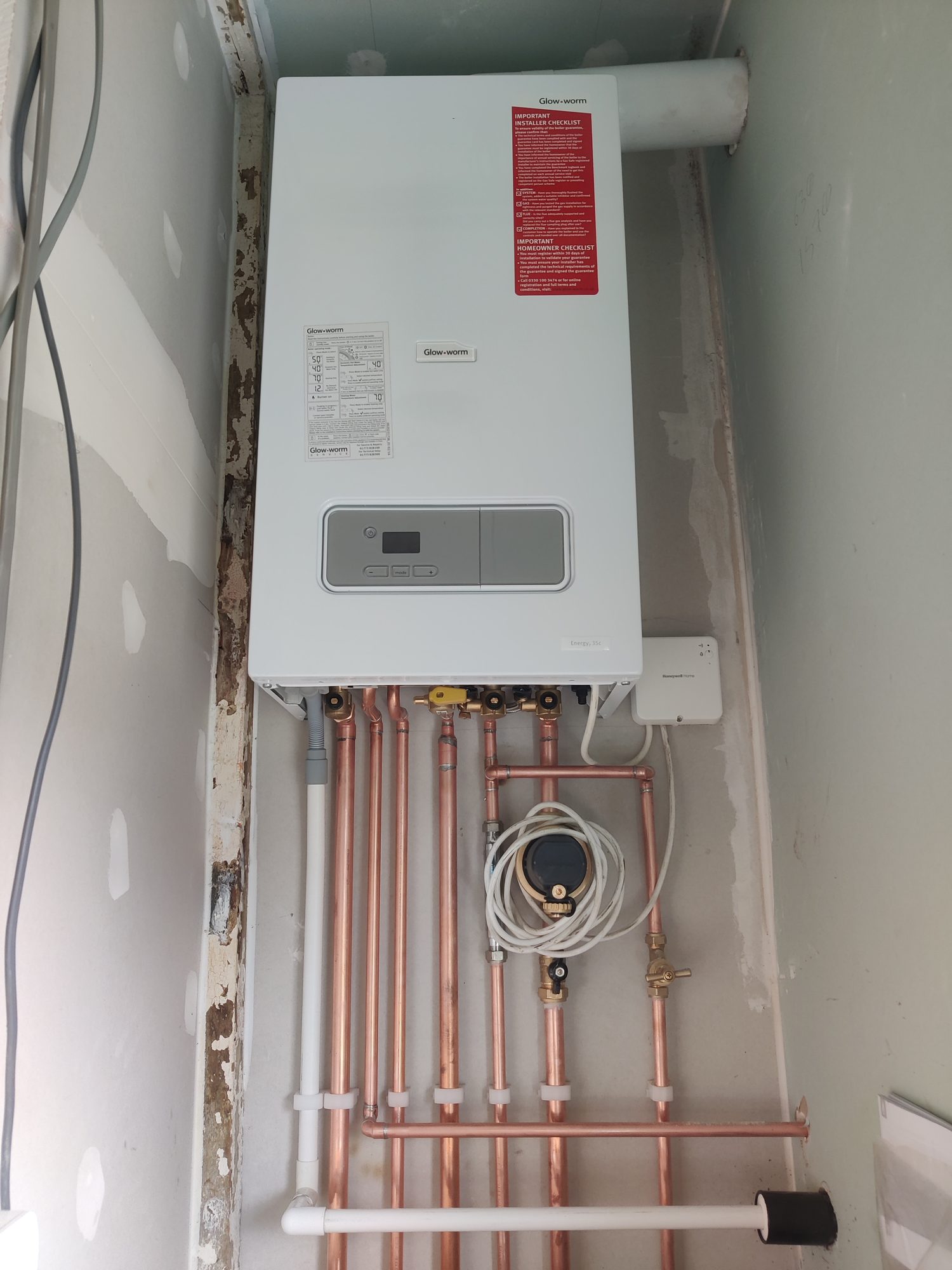 Glow-worm combi boiler with copper pipework, gas valve and Honeywell control after a boiler repair